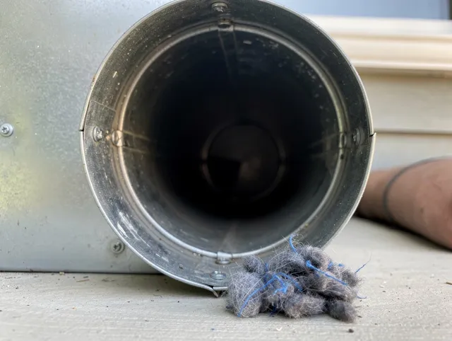 Yorba Linda Dryer Vent Cleaning technician using specialized equipment to clear severe dryer vent blockage in Yorba Linda